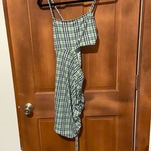 Green plaid cutout dress with ruffles on the side